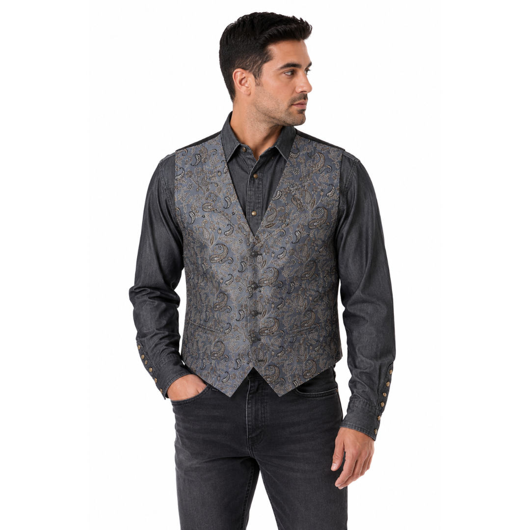 Grey floral western vest worn open over a dark patterned shirt and jeans