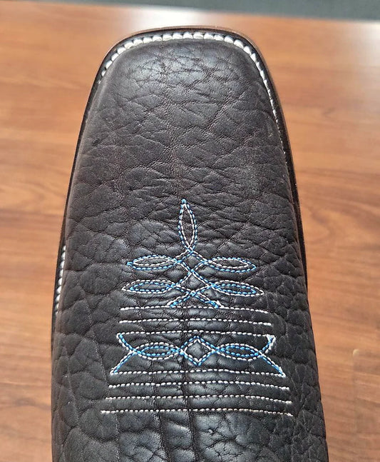 Oiled bullhide cowboy boot with a 12-inch shaft and spur ledge
