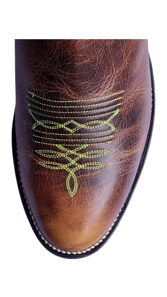 Tall tan cowboy boot with a spur ledge at the heel