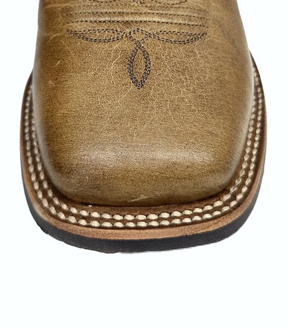 Pull-on cowboy boot with a shaped shaft and western heel